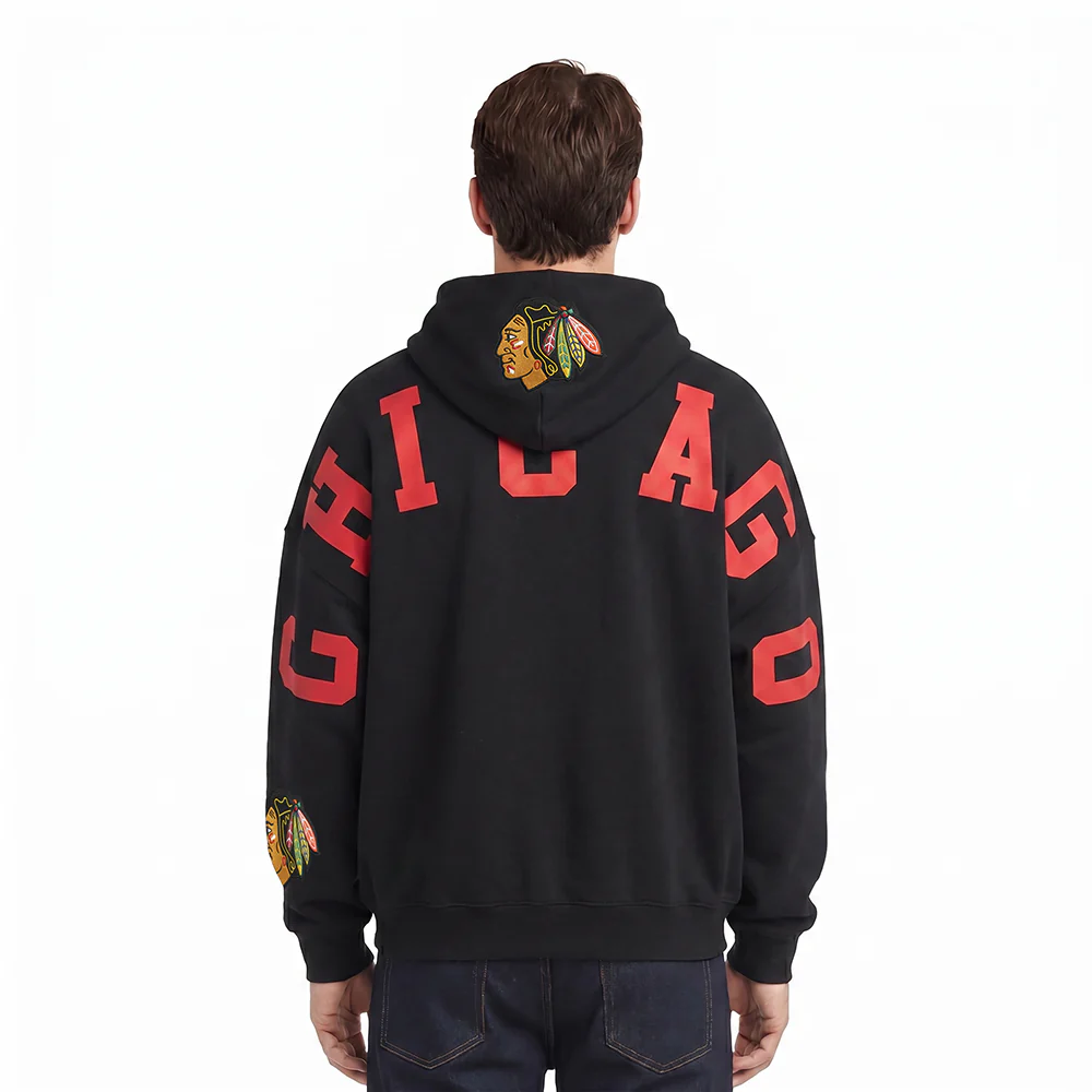 NHL CHICAGO BLACKHAWKS WINGSPAN MEN'S DROP SHOULDER FLEECE PULLOVER HOODIE (BLACK)
